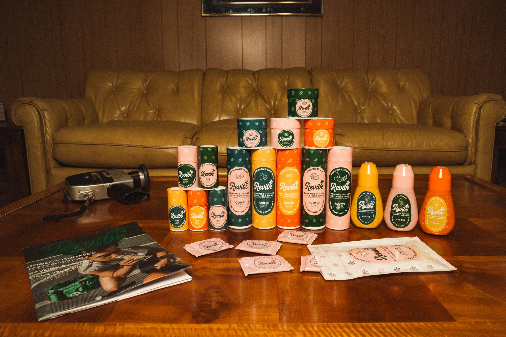 The full Revibe lineup of drinks, gummies, toppings and chocolates on a coffee table
