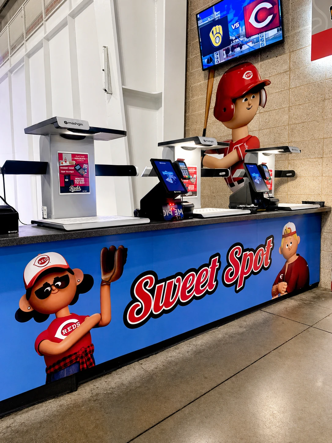Sweet Spot self-checkout counter wrapped with Kroji Reds fans