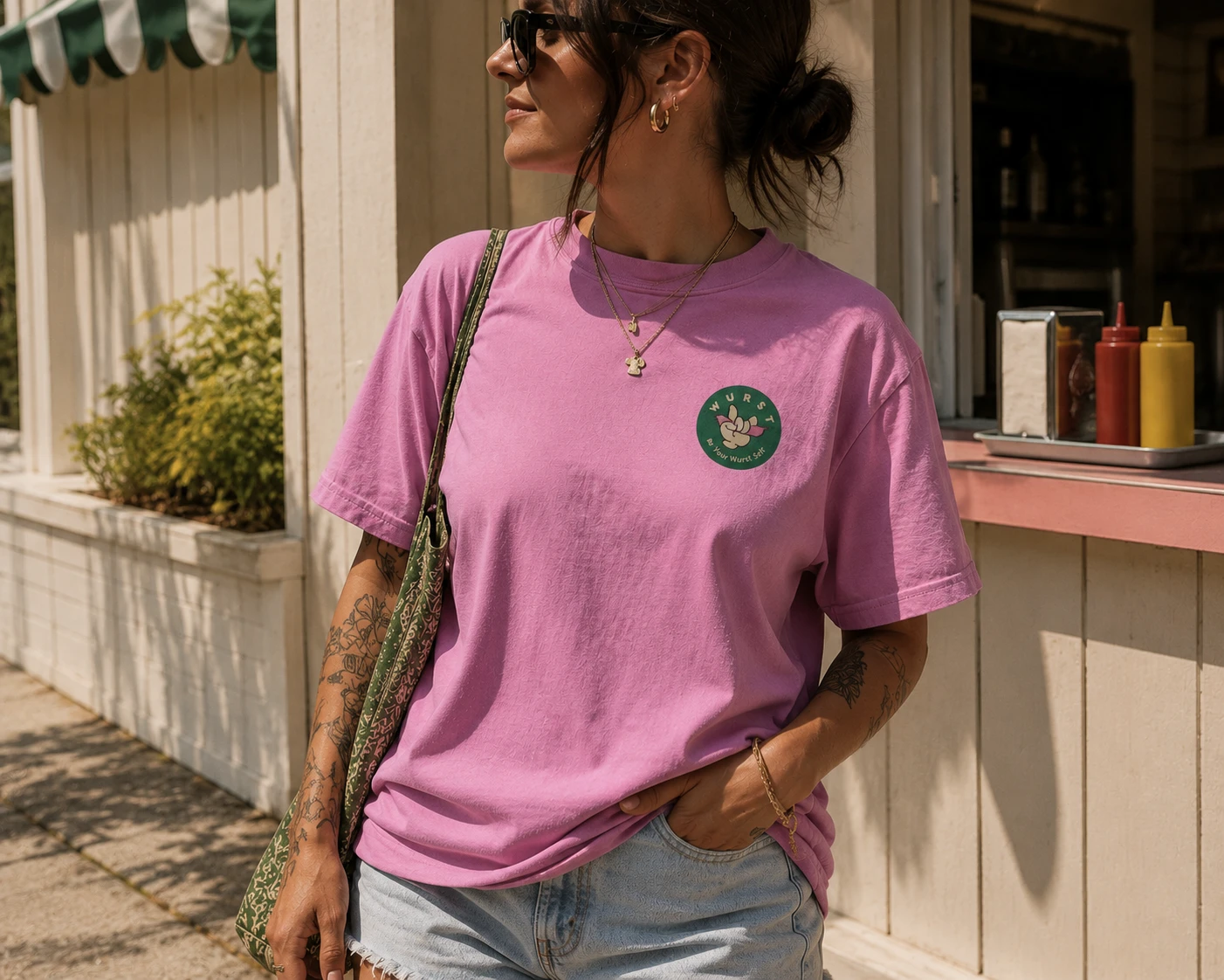 Pink Wurst tee with the rock-on hand badge